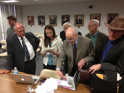 Steve Schafersman watches as Motoko Rich of the NY Times is surrounded by creationists Royal Smith (obscured), Ide Trotter, unknown, and Ray Bohlin.