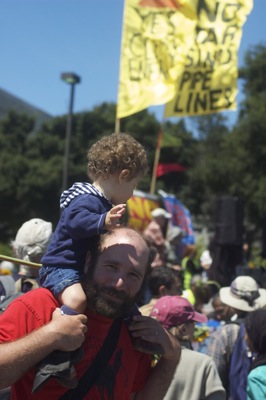 Josh and his baby rally against climate change in Richmond, CA