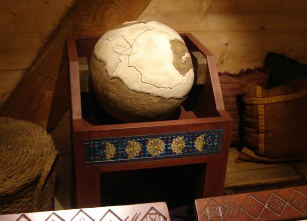 Figure 29. The crudely-made pre-Flood “globe” in Noah’s library. Portions are labeled with antediluvian gibberish language. I couldn’t tell if the lines represented country boundaries or rivers, or mountain ranges.