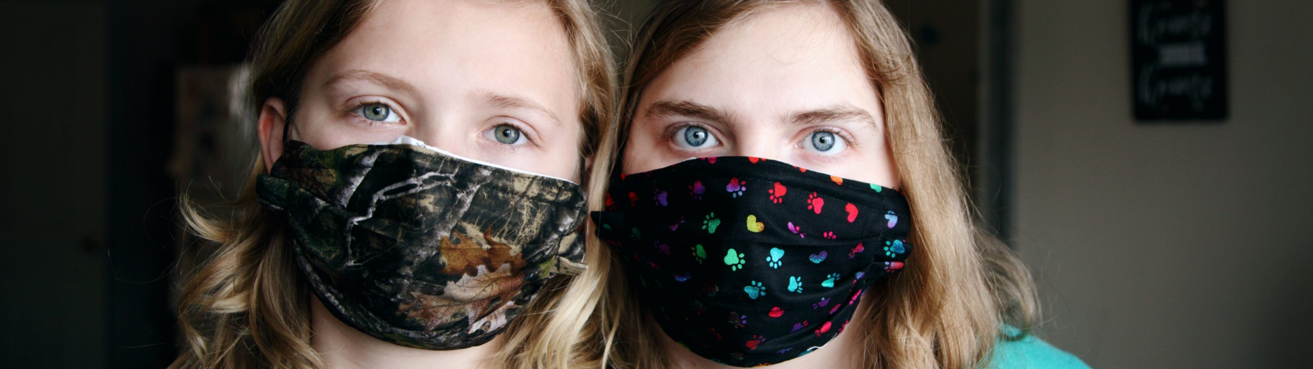 Two children in masks.