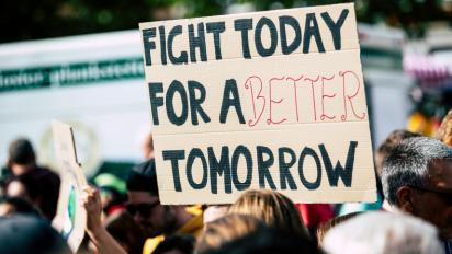 "Fight Today for a Better Tomorrow" sign.