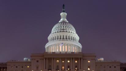 The United States Capitol at night.