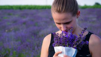 Person smelling flowers
